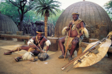 Zulu's in front of hut, Shakaland